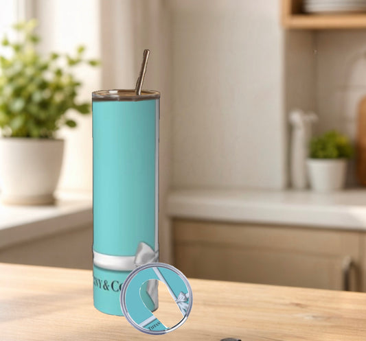 Blue tumbler with straw on a kitchen counter