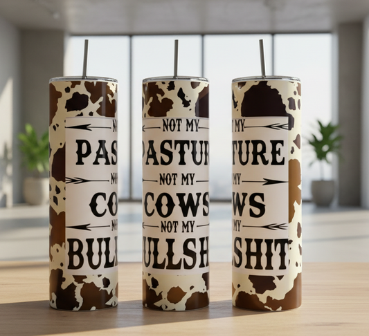 Not My Pasture 20oz Tumbler features a cow-print design, eco-friendly build, metal straw, and the bold black phrase “Not my pasture, not my cows, not my bullshit” on a white background.