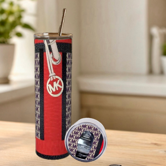 Tumbler with MK logo on a wooden surface