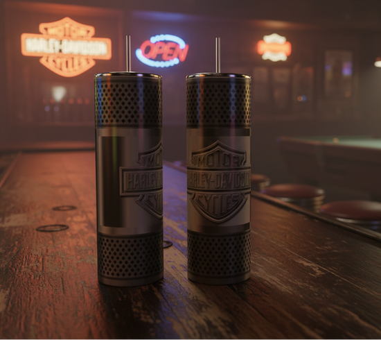 Two tall cylindrical metal cups with Harley-Davidson logos and straws, standing on a wooden bar counter in a dimly lit bar setting.