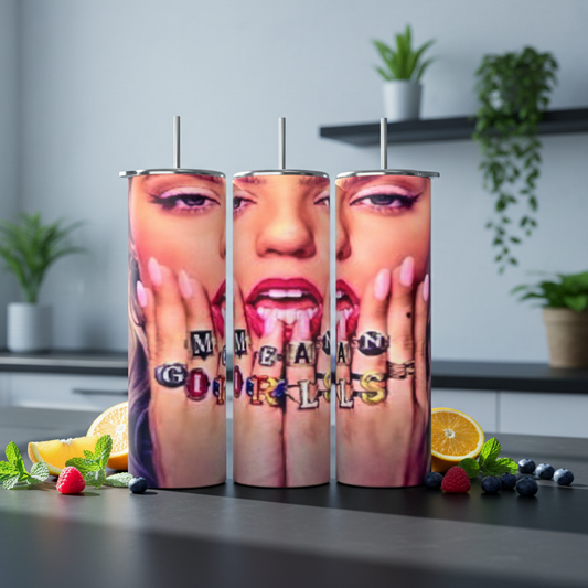 Three tumbler cups with a graphic design on a kitchen counter.