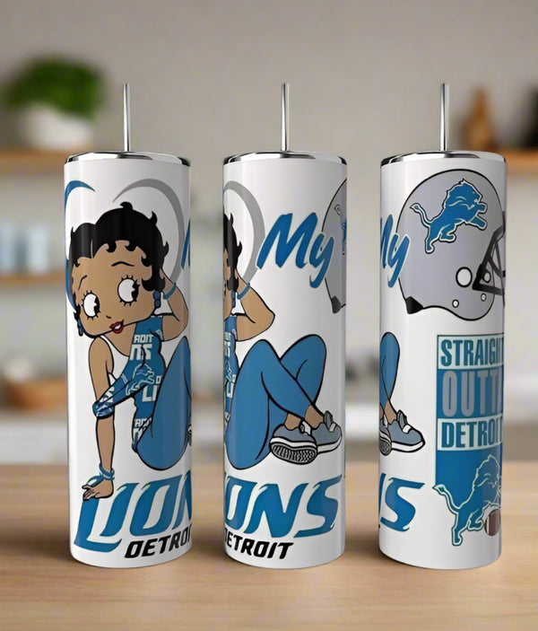 Three Kreative Kreationz Detroit Lions Betty Boop 20oz tumblers with cartoon Betty Boop in Lions gear, team logos, and phrases like "My Lions Detroit" and "Straight Outta Detroit" sit on a kitchen counter.