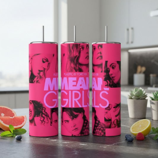 Three pink tumblers with a graphic design on a kitchen counter.