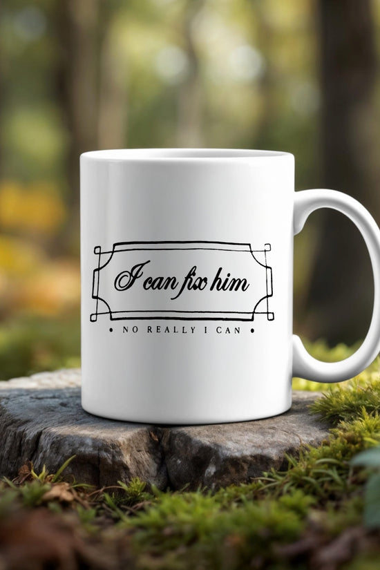 The "I can fix him Ceramic Mug" by Kreative Kreationz features the phrase "I can fix him. No really I can" and sits on a mossy tree stump—an ideal Swiftie gift for any Taylor Swift fan.